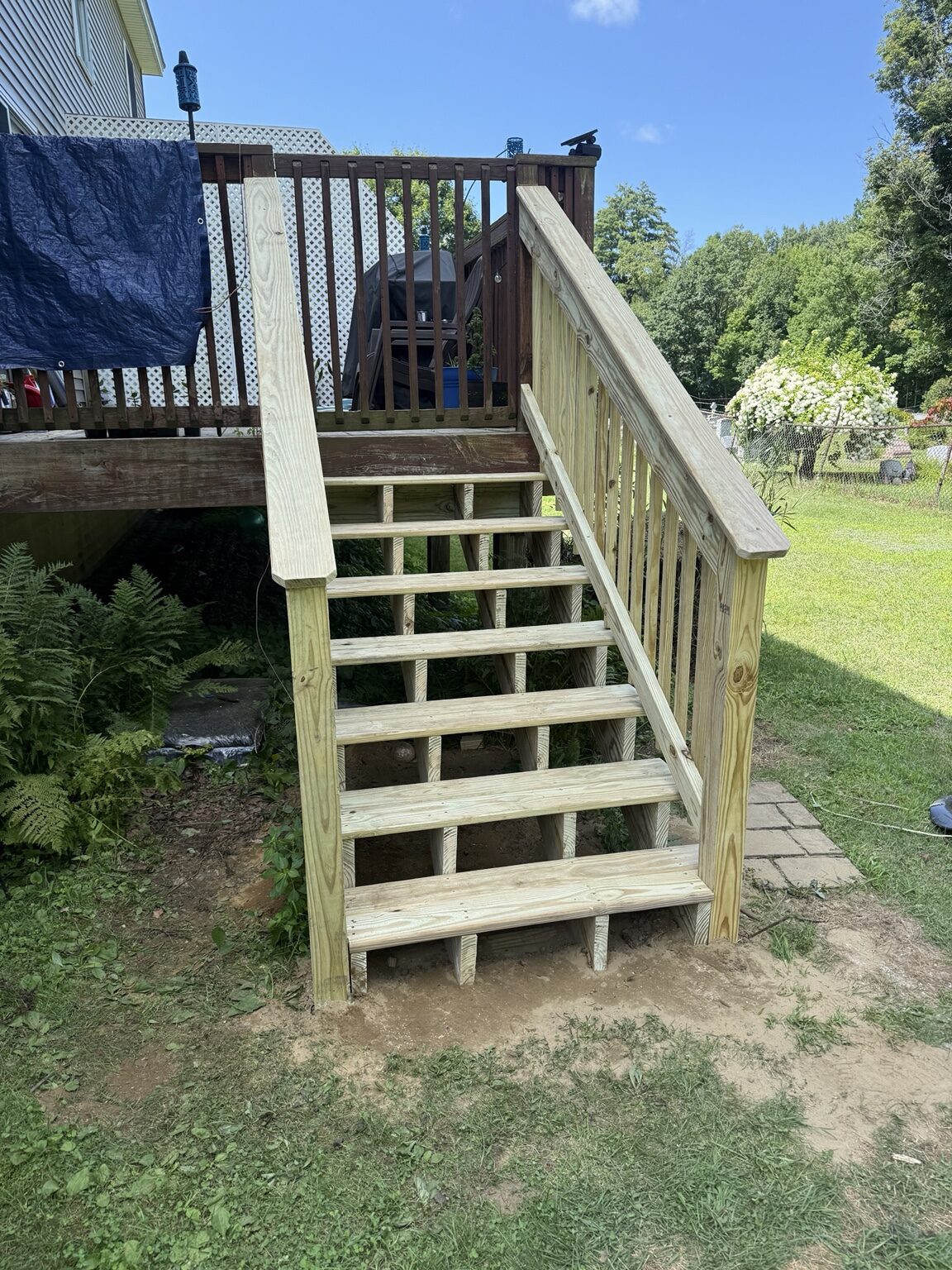 New pressure-treated deck stairs and railing
